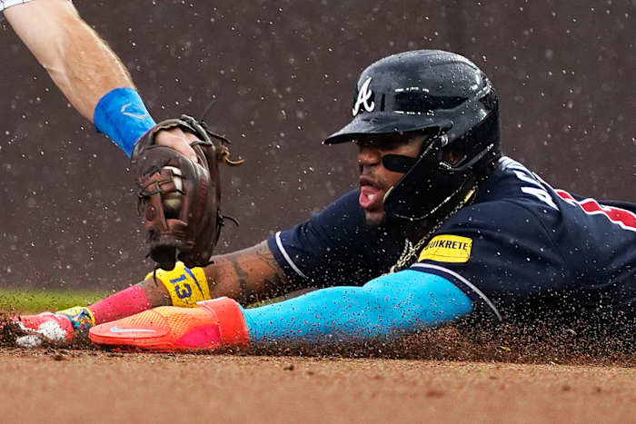 Aug 5, 2023; Chicago, Illinois, USA; Atlanta Braves right fielder Ronald Acuna Jr. (13) steals second base as Chicago Cubs shortstop Dansby Swanson (7) makes a late tag during the first inning at Wrigley Field.